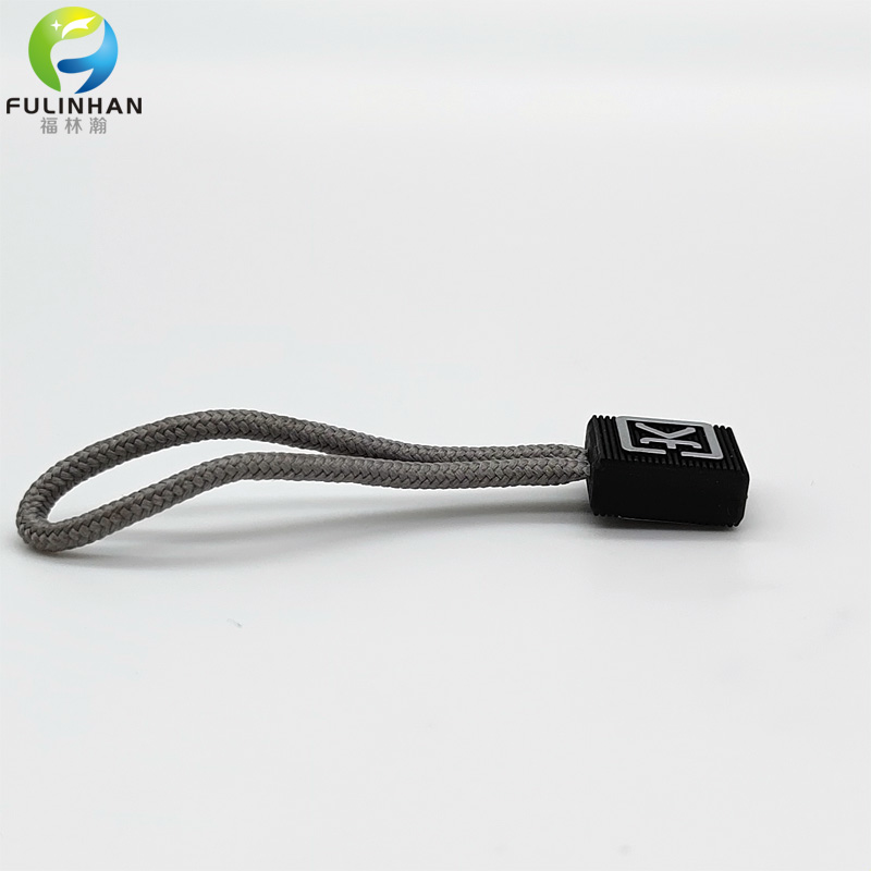 zip puller with embossed logo